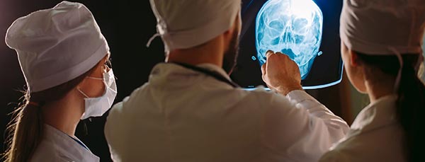 doctors inspecting injuries