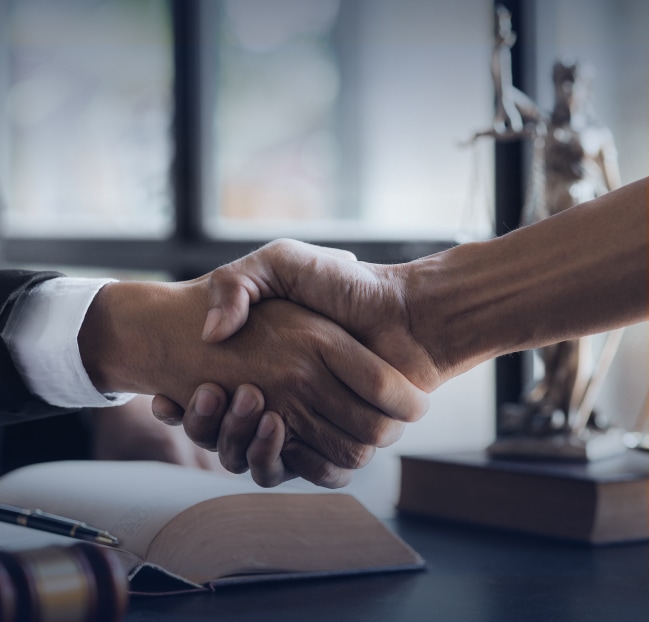 Handshake between client and lawyer